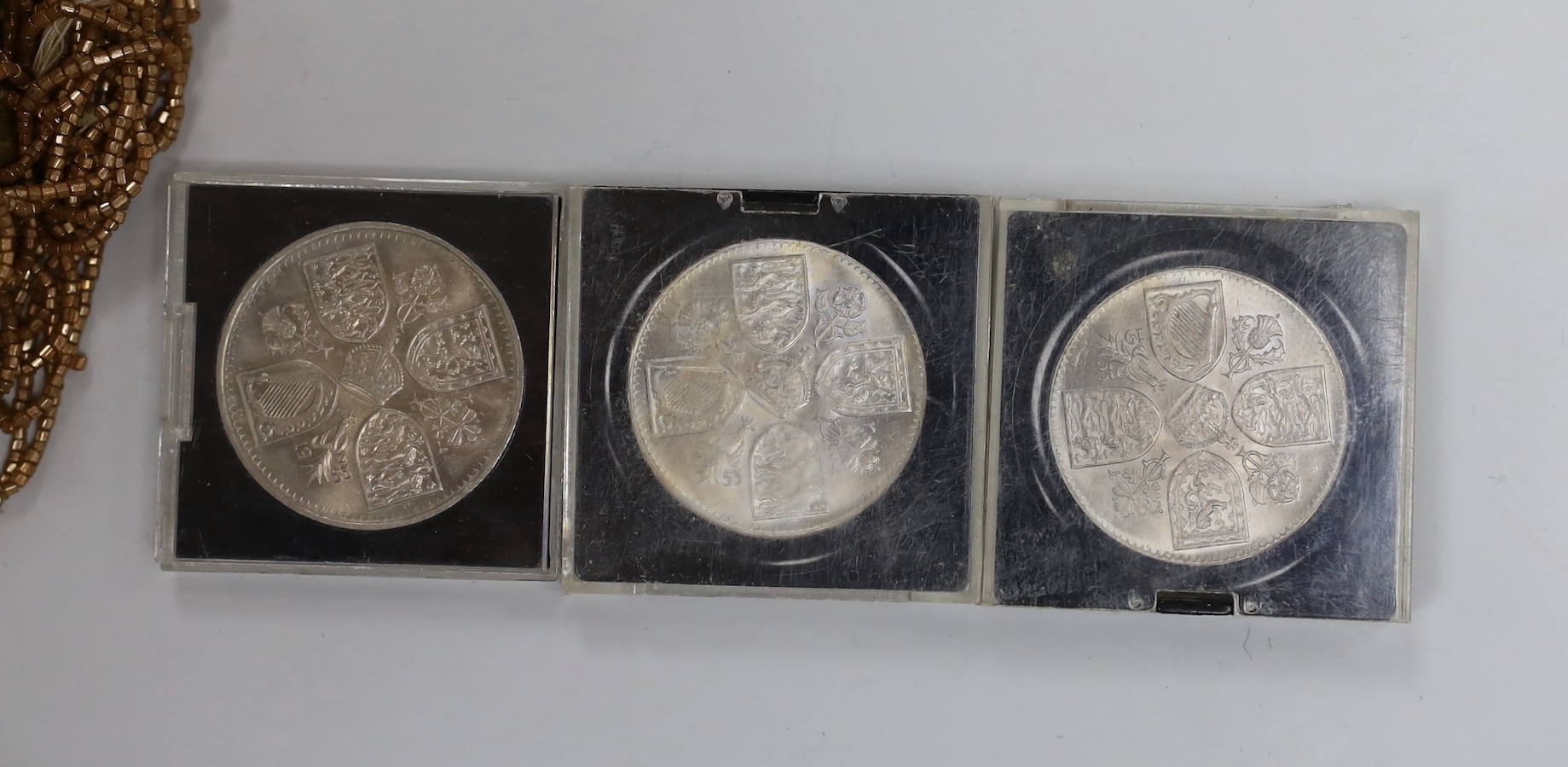 A selection of collectibles, including two silver photo frames, badge buttons, buckles, beading, coinage etc.